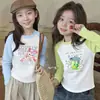 Nova Camiseta de Algodão Puro com Manga Longa para Meninas Primavera/Outono 2026 Roupa de Outono Estilo Coreano Camiseta Cartoon Curva Infantil Camada Base Ins