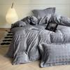 Novo conjunto de quatro peças jacquard de cetim de algodão 60 luxo leve cor sólida nude pele-amigável lençol de cama conjunto de quatro peças de algodão puro