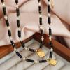 Collar hecho a mano con cuentas de piedra natural bohemia, ágata negra, ojo de tigre, colgante de corazón versátil, cadena de clavícula