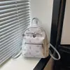 Bolso de estilo girly de alta gama, nueva moda y fresco 2026 mochila de viaje versátil, bolso casual de doble hombro estampado