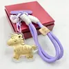 Llavero de Hazte Rico Inmediatamente Zodiaco de Dibujos Animados Llave de Coche Colgante de Pony Dorado Versátil para Pareja Adorno Lindo