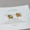 Pendientes Minimalistas de Oro con Moneda de Caballo para Mujer 2026 Nuevo Estilo Pendientes de Alta Gama que Simbolizan Riqueza Instantánea