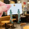 Nuevos Pendientes Largos de Lujo Ligero con Sentido de Alta Gama Temperamento Elegante Diseño de Nicho Orejeras de Moda Nudo Colgante de Pendiente de Gota de Agua