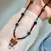 Colar de Contas Estilo Étnico Retrô Pedra Olho de Tigre Marrom Brincos de Luxo Acessíveis Pingente de Elefantinho de Alta Qualidade Corrente para Clavícula para Mulheres