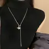 Pingente Pérola de Saturno Corrente de Suéter com Borla 2026 Novo Outono/Inverno Versátil Ajustável com Cordão Ajustável para Mulheres com um Toque de Luxo