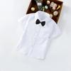 Camisa Blanca de Manga Corta para Niño Fábrica en stock Abrigos Blancos de Manga Corta para Niños Camisa de Verano para Bebé