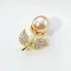 08 broche de moda simple regalo femenino alta gama nicho al por mayor estilo nacional broche joyería fija fabricantes pelo liso