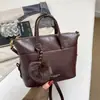 Tendencia Transfronteriza Estilo Coreano Bolso Pequeño Cuadrado de Mano para Mujer Bolso 2026 Otoño Nueva Llegada Color Sólido Bolso de Hombro Simple Bolso Cruzado para Viajes