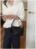 La popular bolsa tejida de diseño de nicho de este año, bolsa tote, bolsa de axila, estilo coreano, versátil, de un solo hombro, cruzada, bolsa de albóndiga