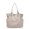 Bolso tote ligero de gran capacidad para mujer, nuevo bolso versátil casual para viajes cortos con múltiples bolsillos, bolso de hombro estilo casual