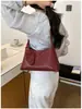 Bolso de hombro tejido de diseño de nicho de alta gama transfronterizo para mujer, nuevo bolso de mano 2026, elegante bolso de hombro para mujer