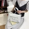Bolso de mujer de alta gama, nuevo para la primavera de 2026, bolso de axila para el trabajo, bolso de hombro cruzado con diseño de nicho, moderno y simple