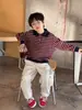 Calça Versátil da Moda para Crianças Outono 2026 Estilo Coreano Calça Longa Bordada para Meninos e Meninas Calça de Moletom Esportiva Estilosa com Punhos Ajustáveis Calça Casual