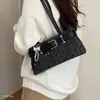 Bolso de mano nuevo para mujer 2026, bolso de hombro para el trabajo, bolso de nicho estilo coreano, bolso versátil para el antebrazo, exquisito y moderno con lunares