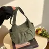 Bolsa Dumpling 2026 Nova Casual Trabalho Mulheres Cordão Popular Versátil Grande Capacidade Xadrez Transversal Bolsa de Ombro