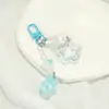 Llavero dulce y fresco de estrella y flor caladas con cascabel, cuentas en forma de corazón, charm para bolso, accesorio para niña, regalo pequeño