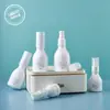 Botella única y exquisita de spray fijador de 150g, botella de aceite desmaquillante de 200ml, botella de loción hidratante de 100ml, botella de esencia de 50ml