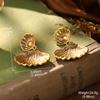 Estilo de corte europeo y americano oro ruso nicho nuevos aretes medievales borla perla diseño ojo de tigre aretes de alta gama