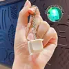 Llavero colgante de Tetris de nueve teclas de moda en colores macaron, accesorio de juguete de botón para aliviar el estrés, venta al por mayor