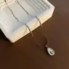 Collar de acero y titanio con perlas de agua dulce naturales para mujer, cadena de clavícula exquisita de alta calidad, joyería anticaída al por mayor