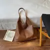 Bolsa de Ombro Única com Textura Trançada Moda Retrô Grande Capacidade Outono 2026 Nova Simples Cor Sólida Alta Aparência Bolsa de Axila Tendência