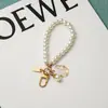 Nova Pulseira Criativa de Pérola Amor Pingente Chaveiro Pingente de Concha Acessórios de Pérola Celebrante da Internet Pequenas Joias em estoque