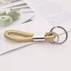 Chaveiro de corda de couro trançado com anel duplo para homens e mulheres anel de chaveiro de carro pingente de bolsa de boneca atacado