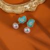 Nuevos pendientes de perlas de hoja de loto de estilo chino, moda nacional, estilo chino, pintura al óleo, temperamento ligero de lujo, pendientes de moda de alta gama.