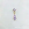 ASTMF-13 aleación de titanio colección oro morado claro aretes G23 titanio rosca interna circonita pernos para labio pernos para piercing