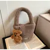Mini Bolso de Felpa de Alta Gama Transfronterizo para Mujer Otoño e Invierno 2025 Nuevo Popular Bolso Cubo Cruzado de Mano de Felpa