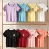 Nova coleção de verão: Camisetas de manga curta para meninas, camisolas de manga curta de seda gelada e blusas estilosas com acabamento em renda para bebês meninas