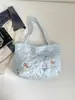 Bolsa de Mão Tote Vento Grande Capacidade Menina 2026 Desenho Animado Novo Bordado Mulher Bonita Ombro Único Versátil Moda Outono