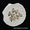 ABS Estampado en Oro Perla Sintética 22*29 Moño Pulsera DIY Cadena para Teléfono Colgante para Coche Accesorios Cuentas Moda Venta al por Mayor