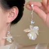 Brincos de Franja Flor de Ouro para Meninas Estilo Hong Kong Únicos Exagerados para Rosto Redondo Nicho Acessível Luxo Brincos Elegantes