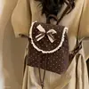 Puntos simples mujer un solo hombro niña moda mariposa dulce otoño nuevo bolso de doble hombro para ir al trabajo 2026 bolso de mano festival