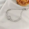 Collar de verano para mujer, sin decoloración, con trébol de cuatro hojas y circonitas, conjunto de tres piezas, collar de acero de titanio, accesorios de alta gama giratorios transfronterizos.
