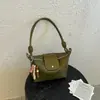 A bolsa de bolinho trançada popular deste ano para mulheres 2026 nova bolsa de ombro simples estilosa bolsa transversal de nicho coreana