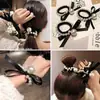 Estilo coreano laço preto pérola laço de cabelo fita corda de cabelo corda de cabelo grosso elástico internet popular doce nova moda corda de cabelo