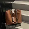 Bolsa de Couro PU Tecido de Luxo para Mulheres 2026 Nova Bolsa de Ombro Retrô Fashion Versátil Bolsa Tote Grande Capacidade Bolsa de Axila