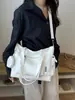 Nuevo bolso de lona para mujer de principios de otoño de 2026, bolso tote versátil para el trabajo, bolso de hombro de gran capacidad para la escuela, bolsos de mujer al por mayor