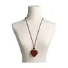 Cadena de suéter con lazo en forma de corazón de estampado de leopardo retro, un diseño único y elegante, con un collar largo geométrico de color café, creando un accesorio chic y atmosférico para mujer