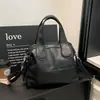 Bolsa Pequena Casual para Mulheres 2026 Nova Versátil Bolsa de Ombro para o Dia a Dia Bolsa de Mão Nova Bolsa Tote Primavera e Verão