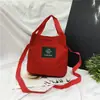 Atacado Primavera e Verão Nova Mochila de Lona Feminina Bolsa de Mão Bolsa Transversal de Ombro Cor Doce Porta-moedas para Celular