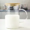 Taza medidora de vidrio al por mayor con escala para hornear en casa, Taza de vidrio resistente al calor para batir huevos, Taza de agua con asa, Taza de leche