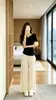 Hermoso conjunto deportivo casual estilo coreano para mujer, conjunto de dos piezas de verano reductor de edad y adelgazante con top de manga corta de seda helada y pantalones tipo falda de pierna ancha