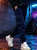 Calça de trabalho estilo americano para homens, coleção primavera/outono, design de múltiplos bolsos, perna afunilada, caimento solto, casual, esportiva, calça comprida, moderna e versátil