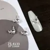 Nuevos diseños de arte para uñas con adornos de circonita cúbica de alta gama, ligeros y lujosos, que incluyen pedrería en las puntas de los dedos estilo francés, decoraciones para uñas versátiles y deslumbrantes, y motivos de corazón y mariposa
