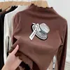 Camiseta Térmica Escovada de Manga Longa com Babados e Gola Meio Alta, Novo Estilo Outono/Inverno 2026 para Bebês Meninas