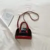Bolso Pequeño para Mujer 2026 Primavera Nueva Moda Retro Bolso de Mano Forma de Concha Bolso Cruzado de Hombro Simple Casual Bolso de Mujer
