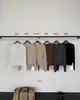 Han Xun Elegante y Sereno Cardigan de Punto Holgado con Bolsillo Falso Cosido y Cuello en V Mezcla de Lana Colección Otoño 2026 27491
